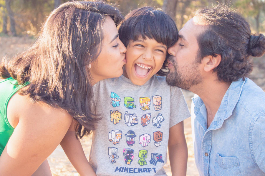 Multi-generational family laughing and celebrating together on a sunny beach