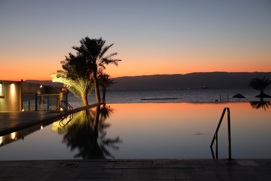 Infinity pool overlooking the ocean at golden sunset